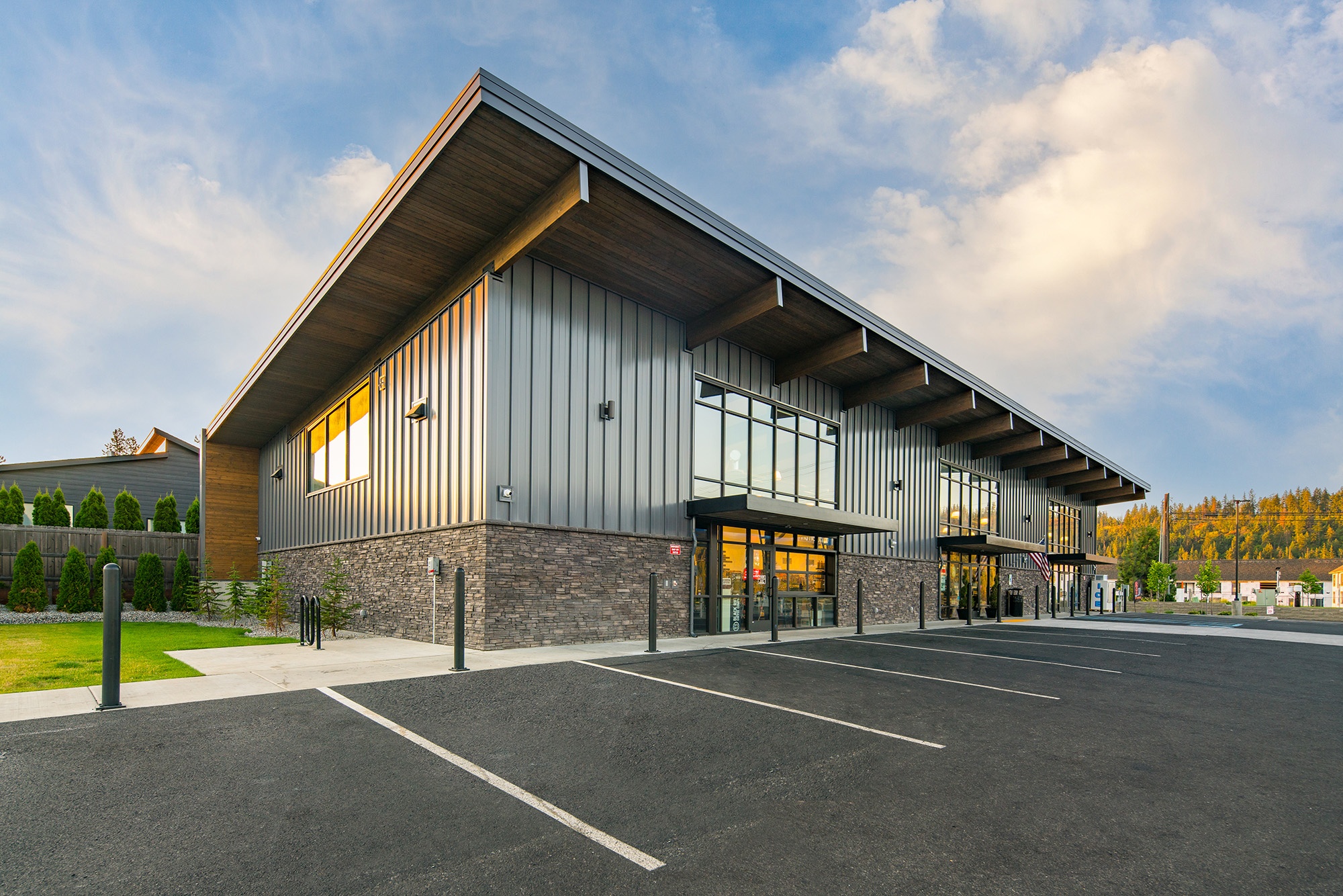 Wide view of Atlas Seltice Gas Station in Coeur d’Alene with canopy, market, and surrounding site context