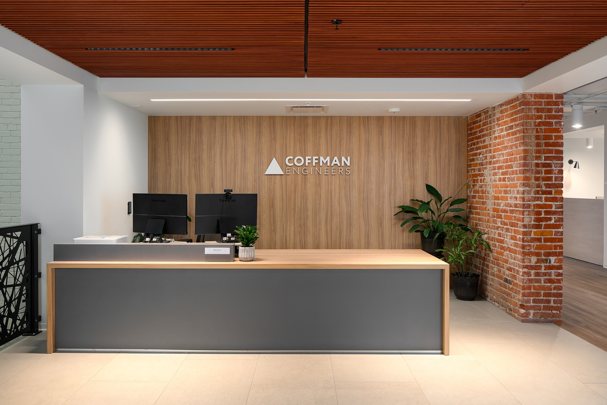 Lobby entrance at Coffman Engineering featuring modern finishes and architectural detailing by Fusion Architecture