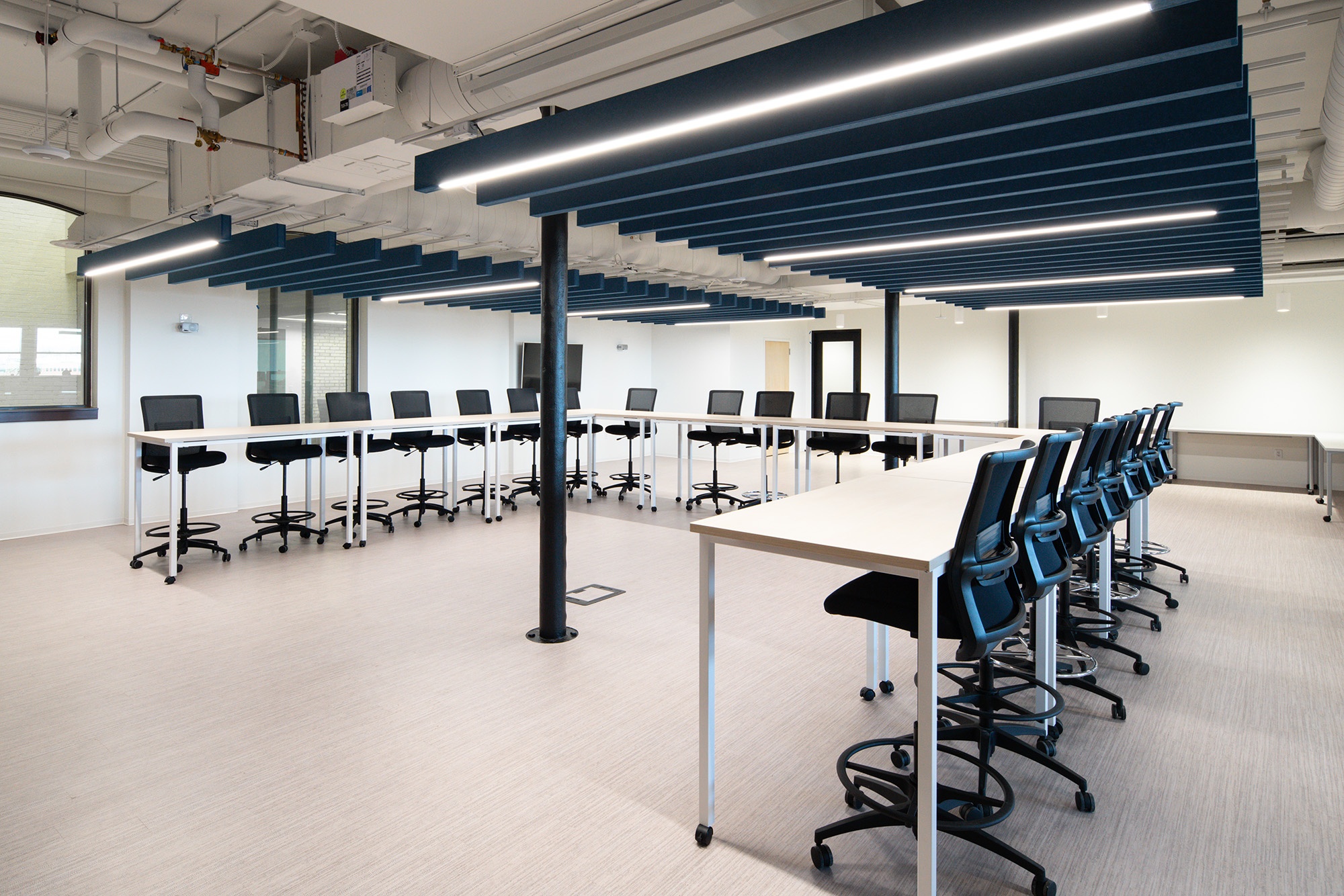 Custom ceiling and lighting detail showcasing sustainable design choices at Coffman Engineering offices